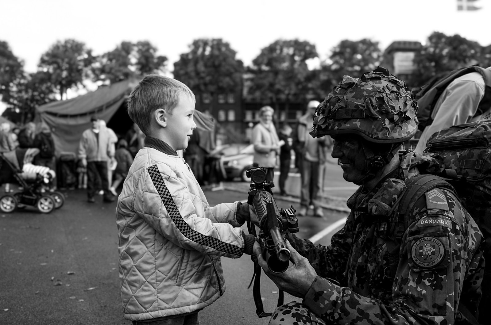 Boy and soldier at a military open day in Haderslev — award-winning photo